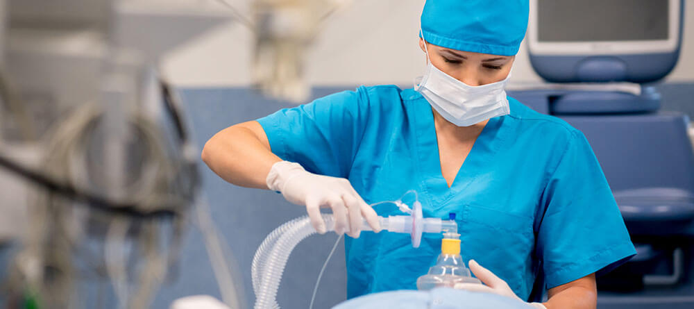 An anesthesiologist sedates a patient before a surgical procedure.
