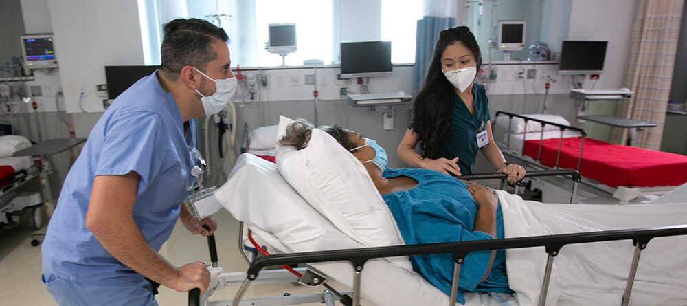 SGU medical students learning hands-on patient care