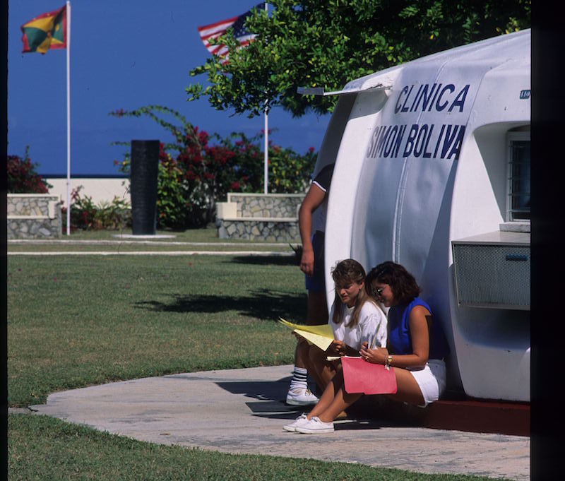 Students studying outside clinic