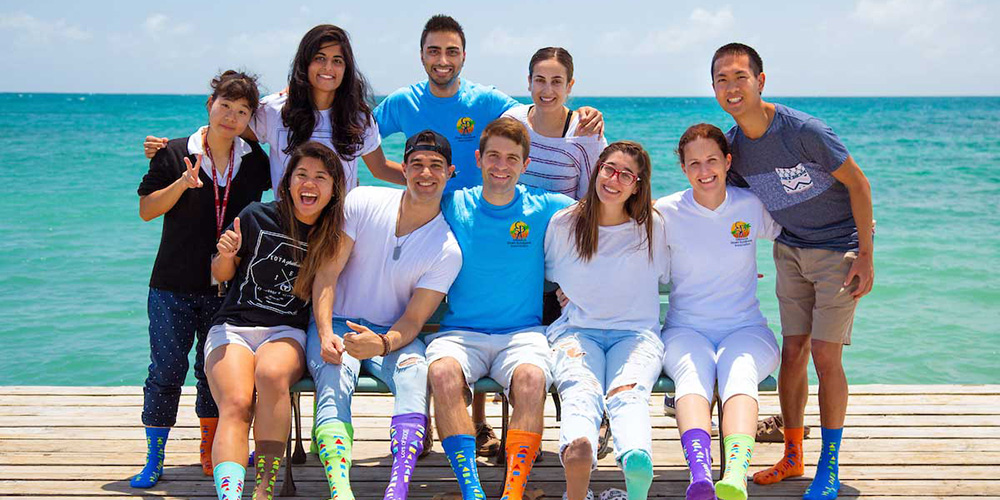 Member of SGU’s Iota Epsilon Alpha Honor Medical Society don mismatched socks on World Down Syndrome Day.|