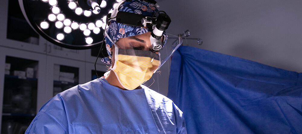 Surgeon focuses on patient during procedure
