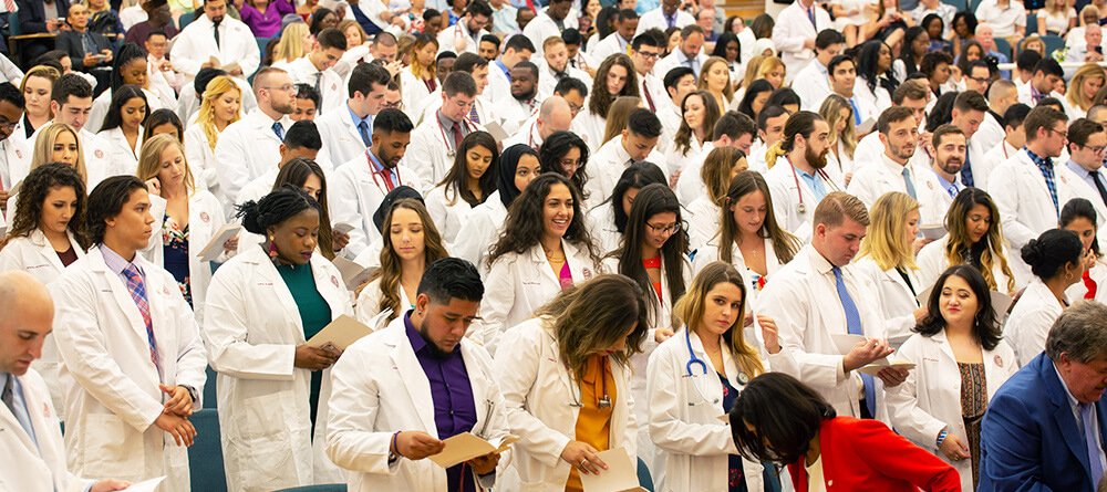 SGU students celebrating White Coat Ceremony