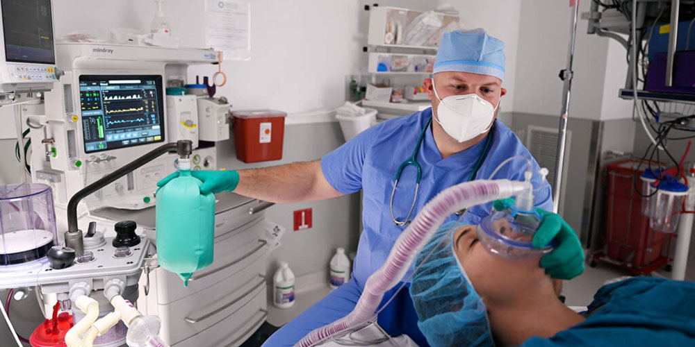 An anesthesiologist sedates a patient before a surgical procedure