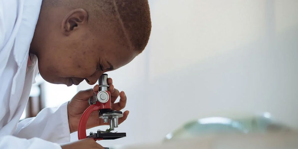 Man Using Microscope