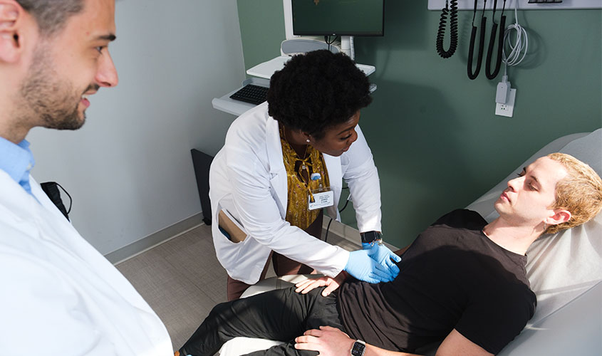 Student examining patient News